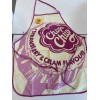 tablier en coton imprimé sucette Chupa en rose et crème cuisine