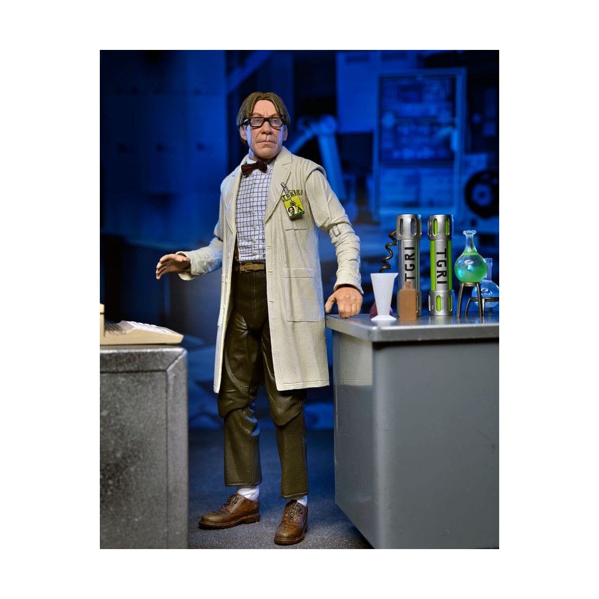 Neca - Profesor Perry con bata de laboratorio y Profesor Perry con traje para materiales peligrosos